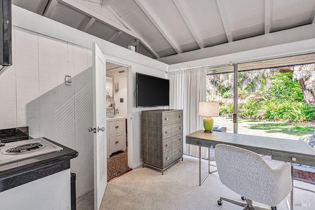 office with light colored carpet and vaulted ceiling with beams