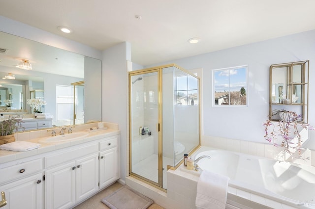 bathroom with visible vents, a garden tub, a stall shower, recessed lighting, and vanity