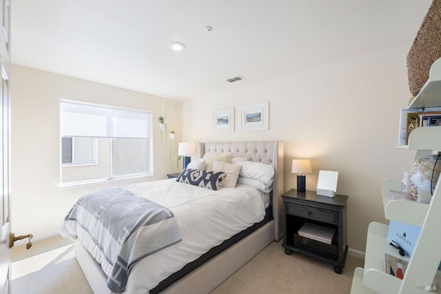 bedroom featuring visible vents, baseboards, and carpet floors