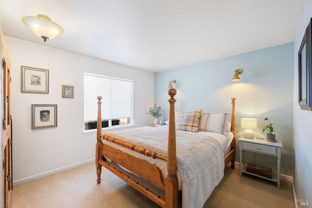 bedroom featuring carpet and baseboards