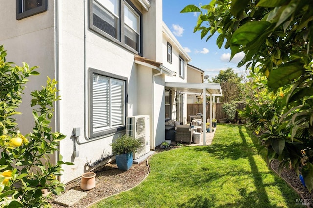 view of yard featuring ac unit and fence