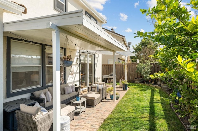 view of patio featuring an outdoor living space and fence