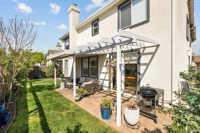 rear view of property featuring stucco siding, a pergola, a patio, a yard, and outdoor lounge area