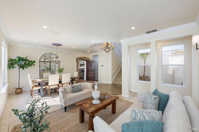 living room featuring stairway, light tile patterned floors, visible vents, and a chandelier