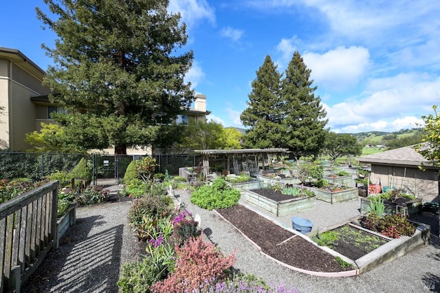 view of yard with a garden and fence