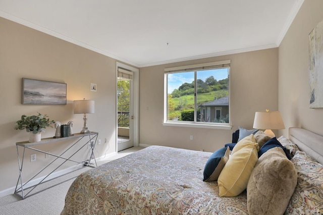 carpeted bedroom with baseboards, access to exterior, and crown molding