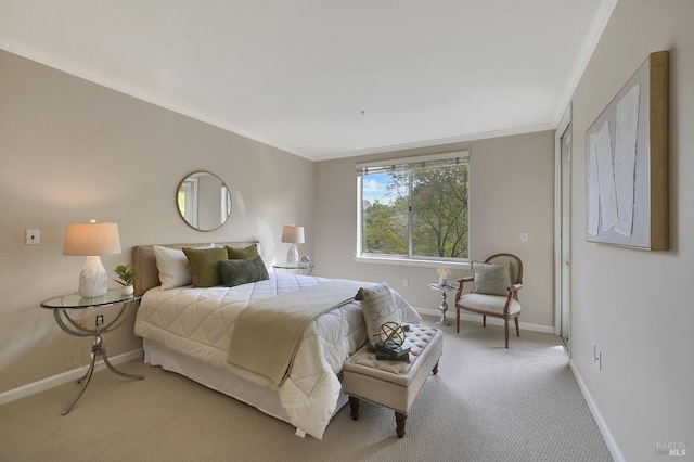 carpeted bedroom featuring crown molding and baseboards