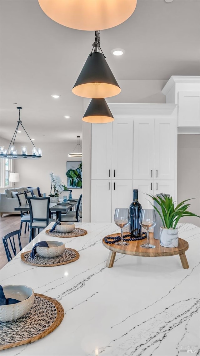 dining room with recessed lighting and an inviting chandelier