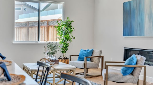 sitting room with wood finished floors and baseboards