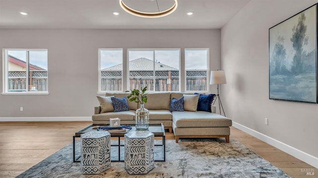 living room with recessed lighting, wood finished floors, and baseboards