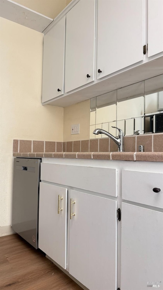 laundry room featuring wood finished floors