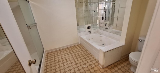 bathroom featuring a tub with jets, baseboards, walk in shower, tile patterned floors, and toilet