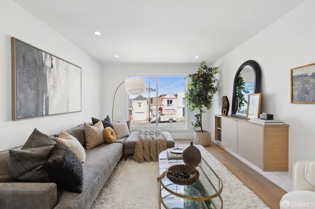 living room with recessed lighting and light wood-type flooring