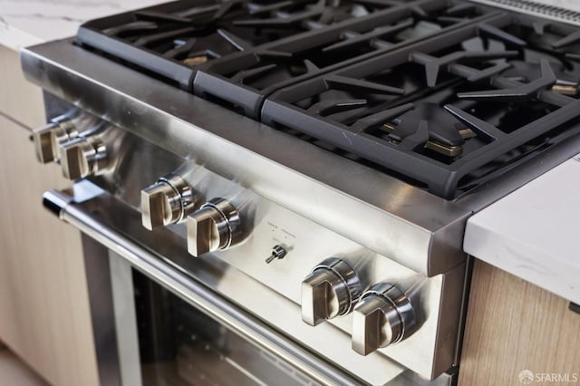 interior details featuring stainless steel gas range oven