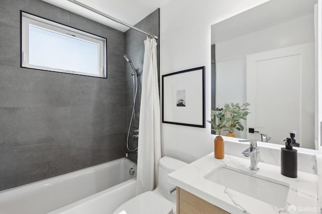 bathroom with vanity, toilet, and shower / bath combo