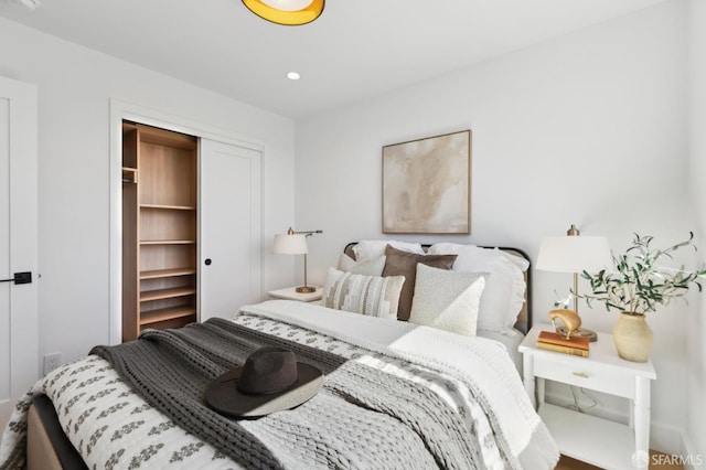 bedroom featuring recessed lighting and a closet