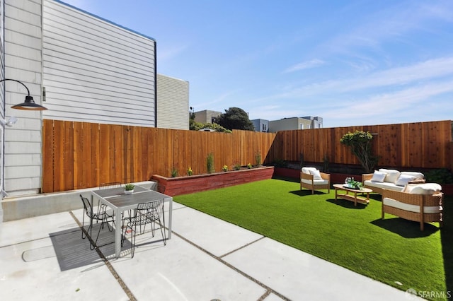 view of patio / terrace with outdoor dining space, an outdoor living space, and a fenced backyard