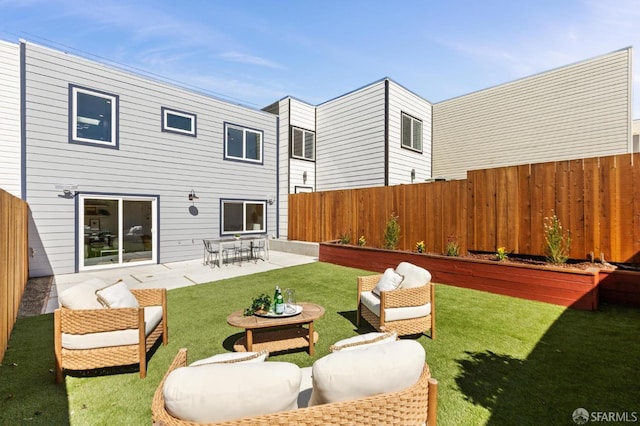 back of property with outdoor lounge area, a patio, and fence