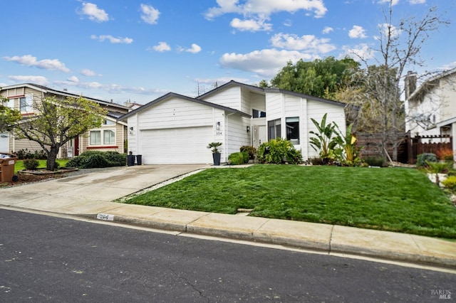 mid-century home featuring driveway, an attached garage, a front lawn, and fence