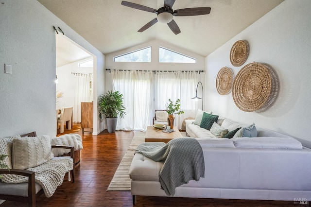 living area with lofted ceiling, ceiling fan, and wood finished floors