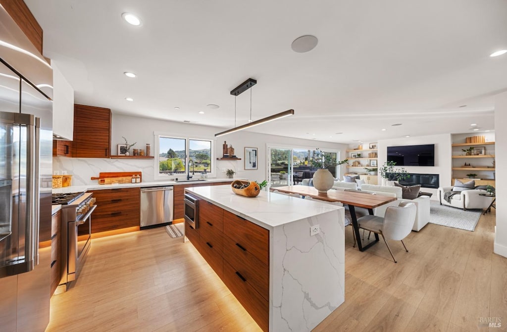 14 Channel Dr, Corte Madera, CA 94925 - kitchen featuring open shelves, premium appliances, a sink, modern cabinets, and brown cabinets