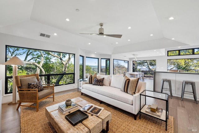 living room featuring recessed lighting, visible vents, and wood finished floors