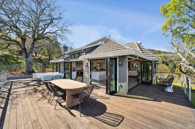 wooden deck with outdoor dining area