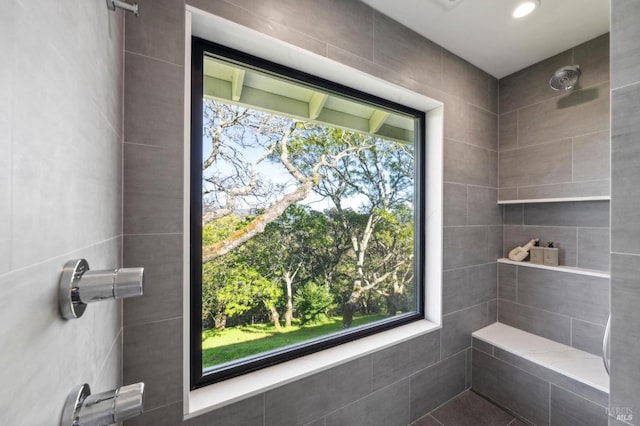 full bathroom with a tile shower