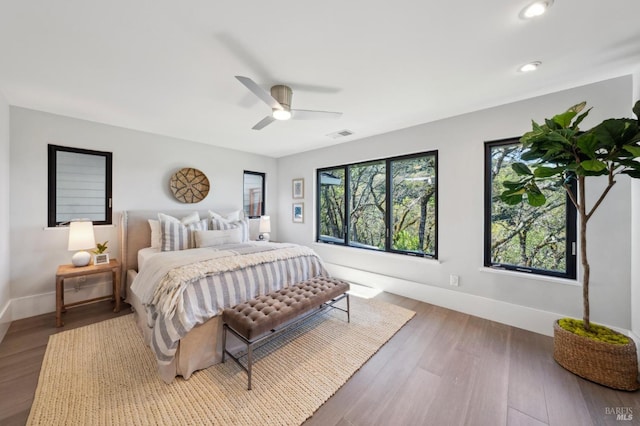 bedroom with visible vents, wood finished floors, recessed lighting, baseboards, and ceiling fan