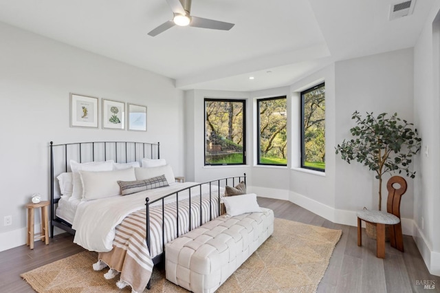 bedroom featuring visible vents, baseboards, recessed lighting, wood finished floors, and a ceiling fan