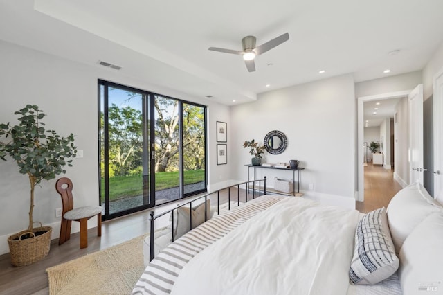 bedroom featuring recessed lighting, visible vents, baseboards, and wood finished floors