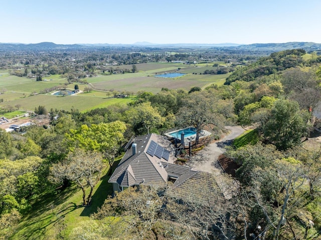 birds eye view of property with a rural view