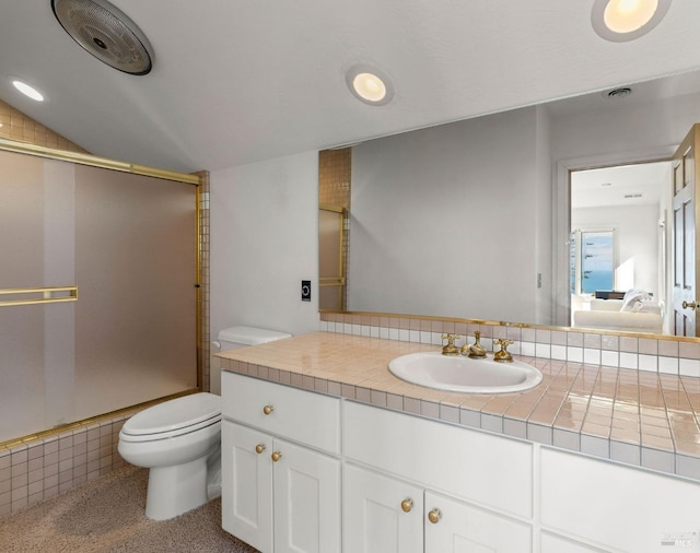 bathroom featuring vanity, visible vents, toilet, a shower with door, and connected bathroom