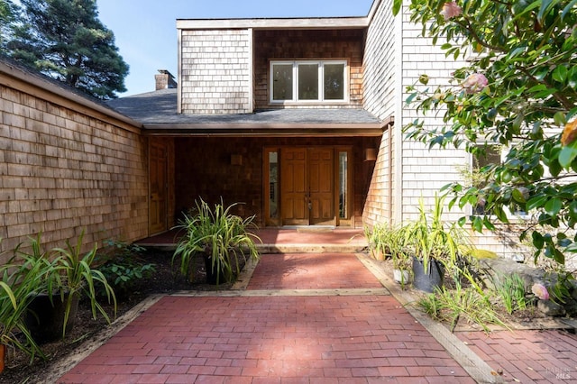 property entrance with a chimney