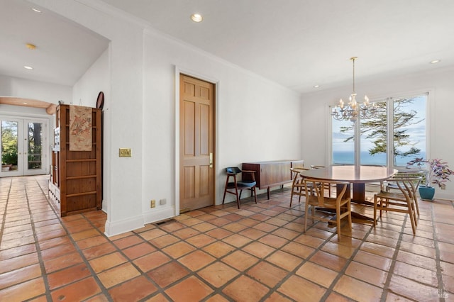 dining area featuring an inviting chandelier, recessed lighting, baseboards, and ornamental molding