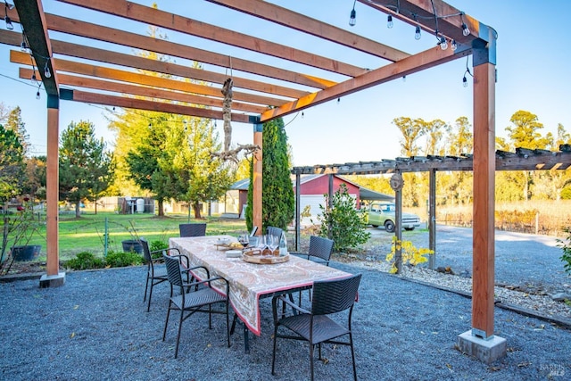 view of patio with outdoor dining area and a pergola