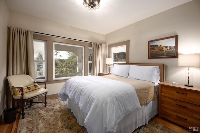 bedroom with wood finished floors