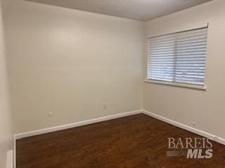 empty room with baseboards