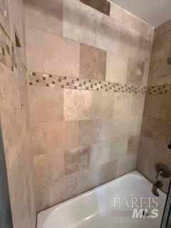 bathroom with shower / bath combination