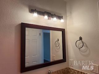 bathroom with a textured wall