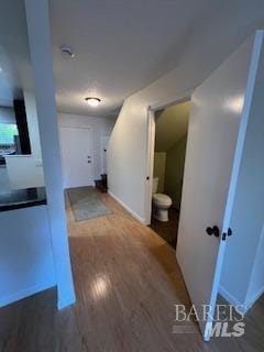corridor with wood finished floors