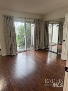 unfurnished room featuring wood finished floors