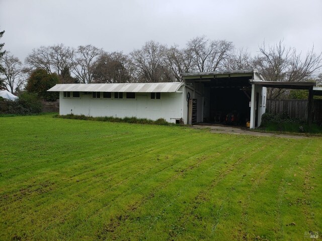 view of pole building with a yard