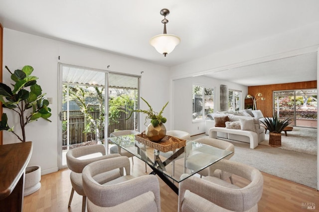 dining area featuring light wood-style flooring