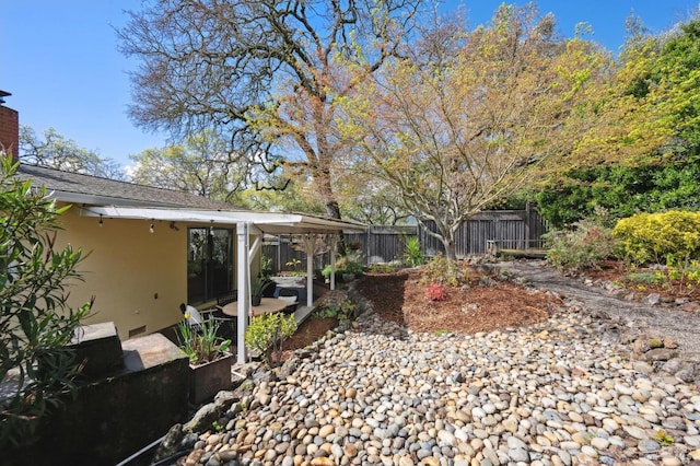 view of yard with a patio and fence