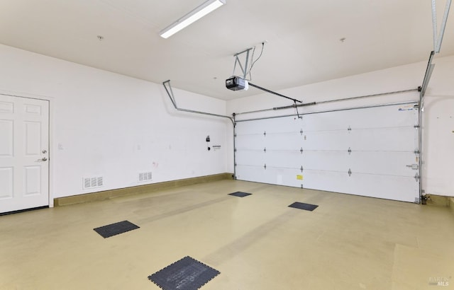503 Twin Lakes Ln, Rio Vista, CA 94571 - garage featuring visible vents and a garage door opener
