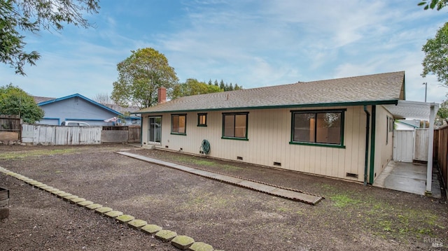 view of front of house featuring fence and crawl space