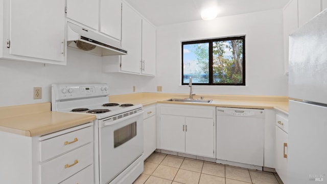 kitchen with under cabinet range hood, a sink, white cabinetry, white appliances, and light tile patterned floors