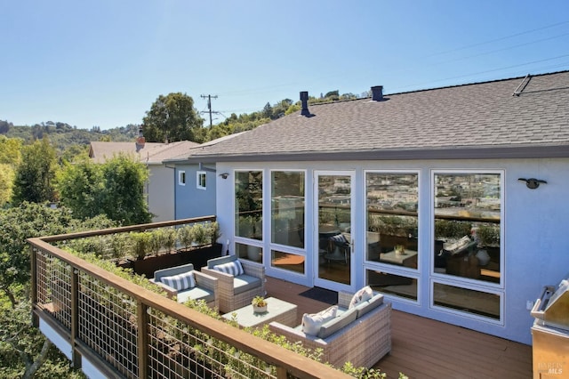 wooden deck featuring an outdoor hangout area