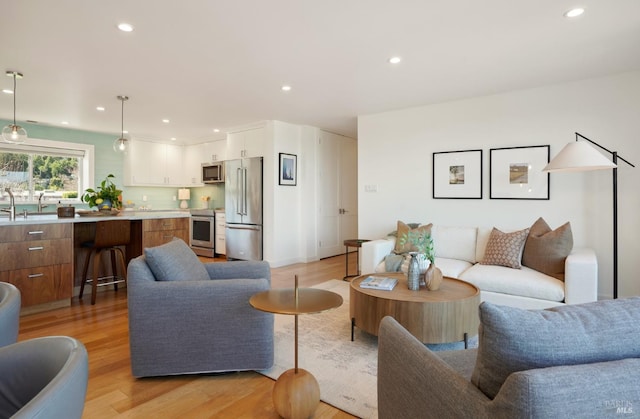 living room featuring recessed lighting and light wood-style floors